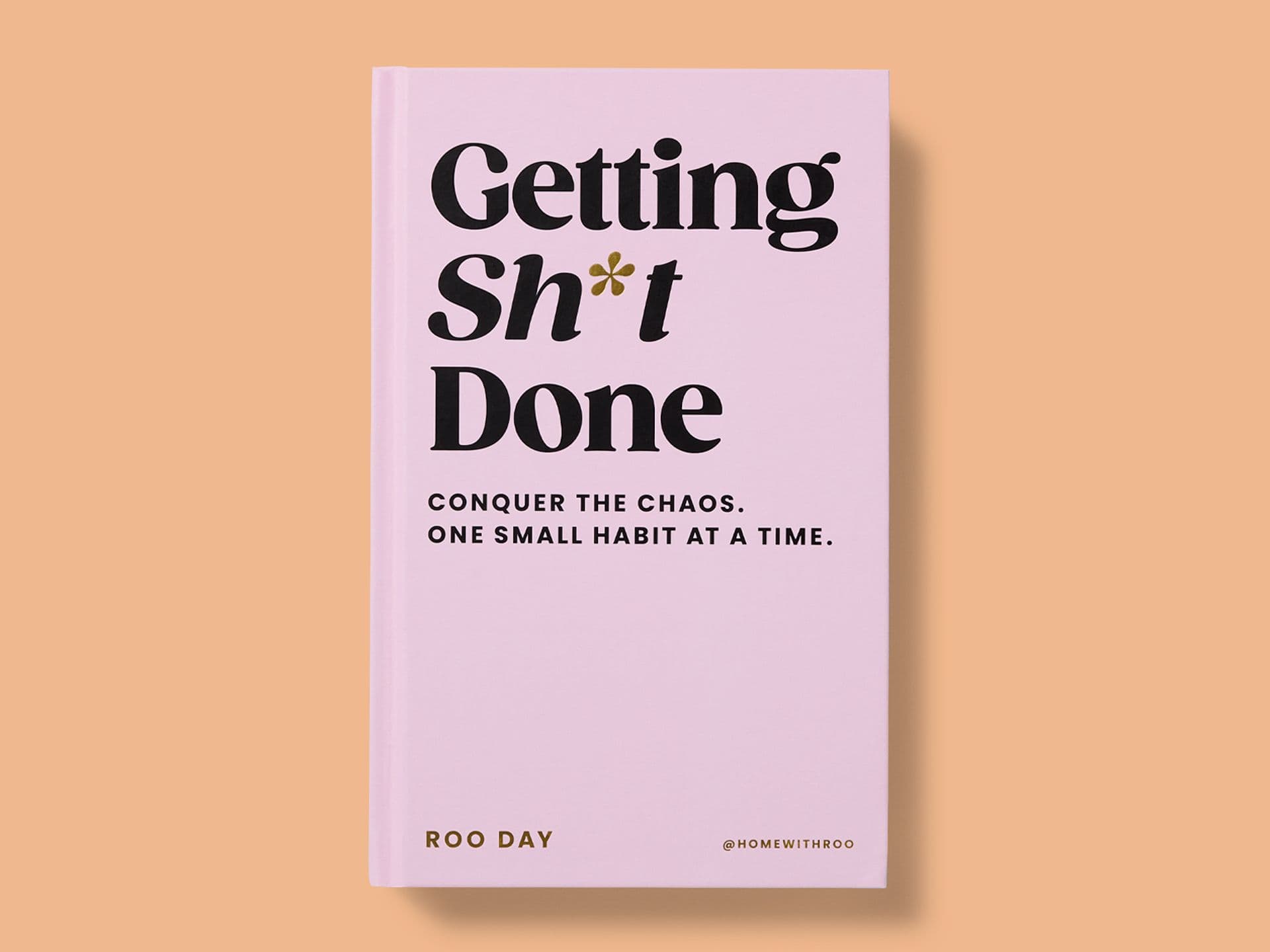 Pink book cover titled *Getting Sh*t Done* by Roo Day, featuring bold black typography with an asterisk symbol, the subtitle “Conquer the chaos. One small habit at a time.”, and the handle “@homewithroo” at the bottom, set against a peach background.